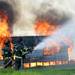 Firefighters sprayed down an area as they monitor a structure engulfed in flames during a training exercise and controlled burn in 6700 block of Warner Rd. in Pittsfield Township on Thursday, May 9, 2013. Melanie Maxwell I AnnArbor.com
